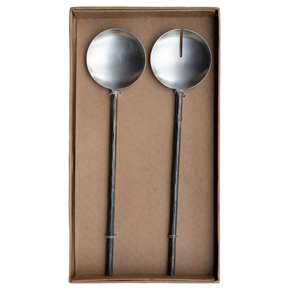A set of handcrafted black metal salad servers from KULALA Living, featuring a modern rustic design with textured handles, elegantly presented in a gift box