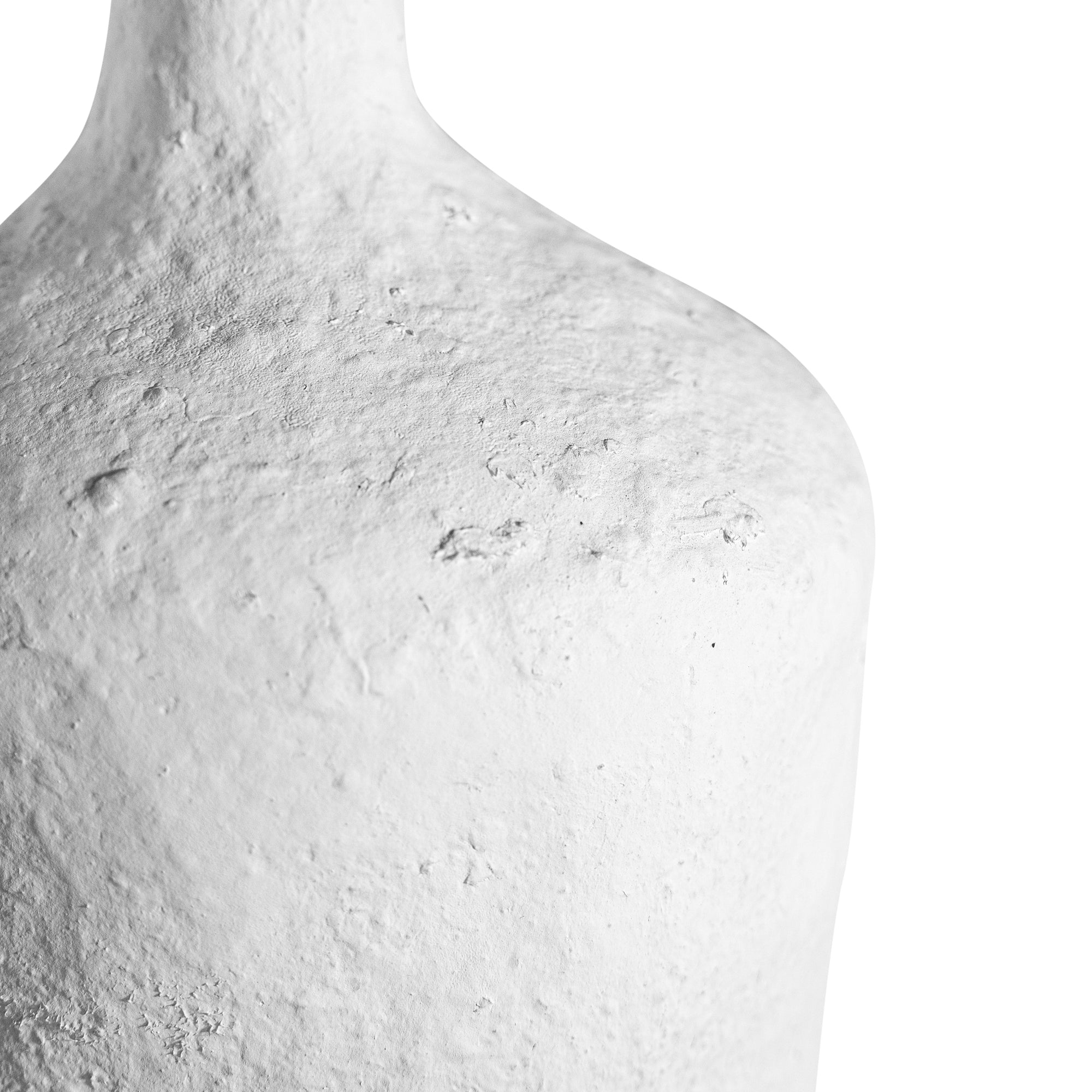 A handcrafted white paper mache vase with a raw, textured finish and an elongated silhouette. A striking sculptural piece perfect for minimalist or contemporary interiors