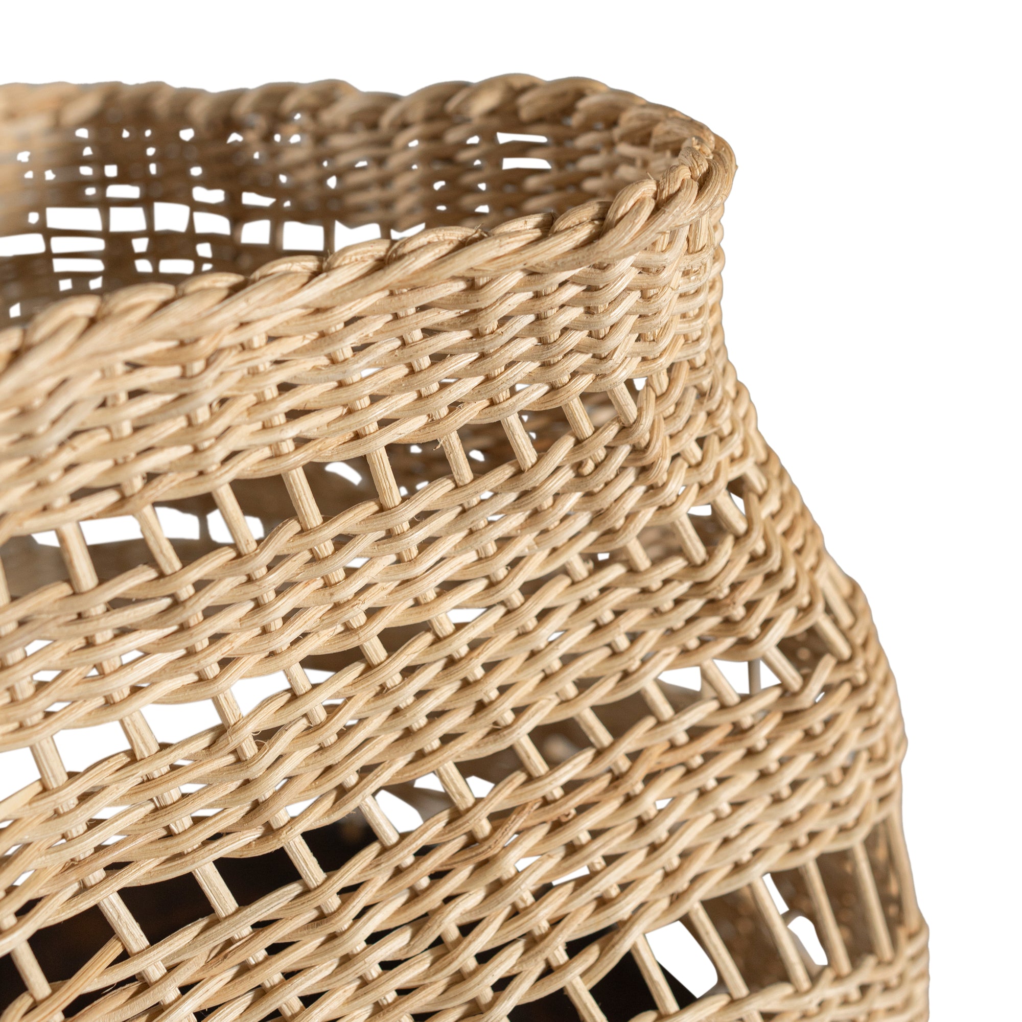A unique handwoven rattan decorative basket with an open-weave design and a dark wooden base. A statement piece that adds texture and organic warmth to any interior