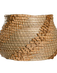 Handwoven seagrass basket with organic textured detailing, featuring natural tones and intricate weaving, ideal for contemporary home decor