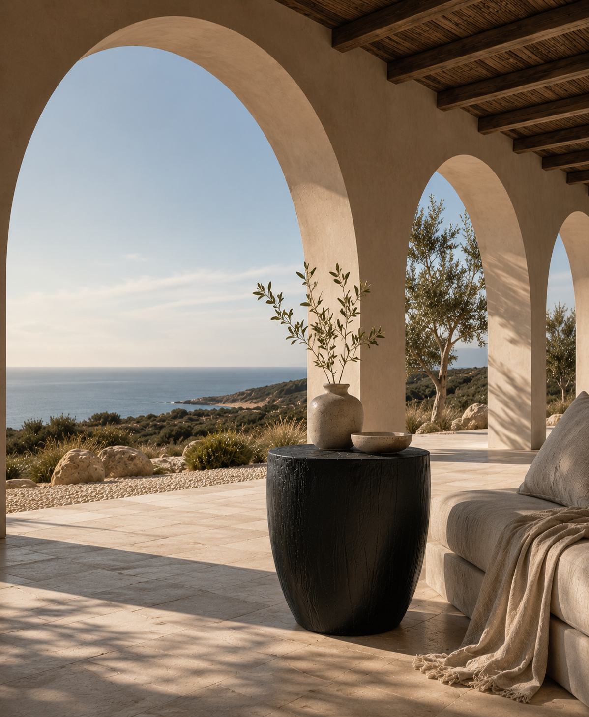 Kisiki Stool in black timber adds sculptural contrast to a relaxed coastal Mediterranean inspired terrace