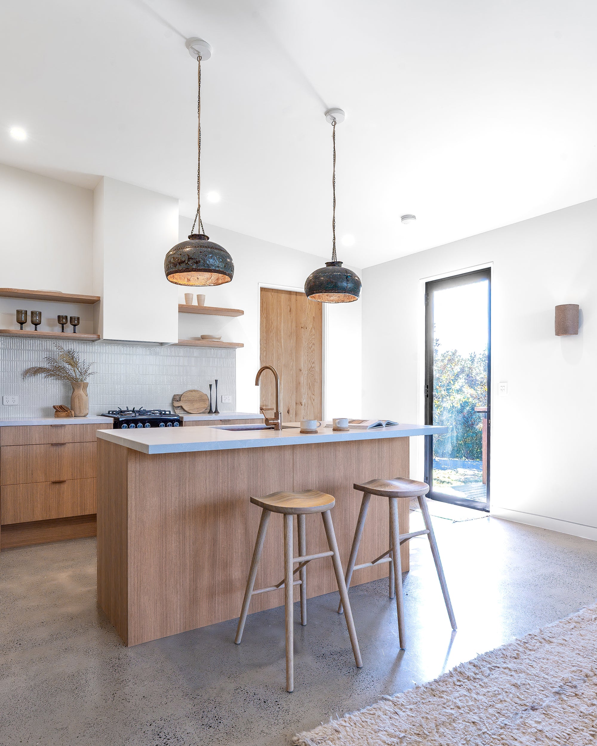Natural wooden bar stool with sleek modern design and contoured seat, perfect for contemporary kitchen or bar settings