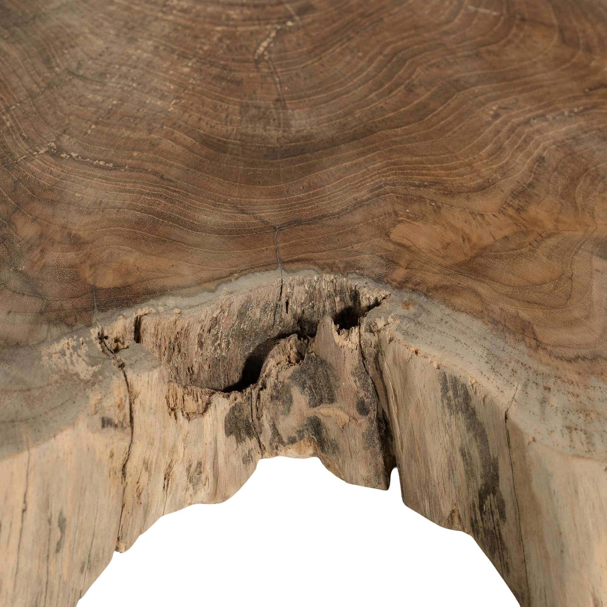 Koro serving board in teak featuring natural edge detail and rich organic wood grain.