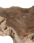 Koro serving board in teak featuring natural edge detail and rich organic wood grain.