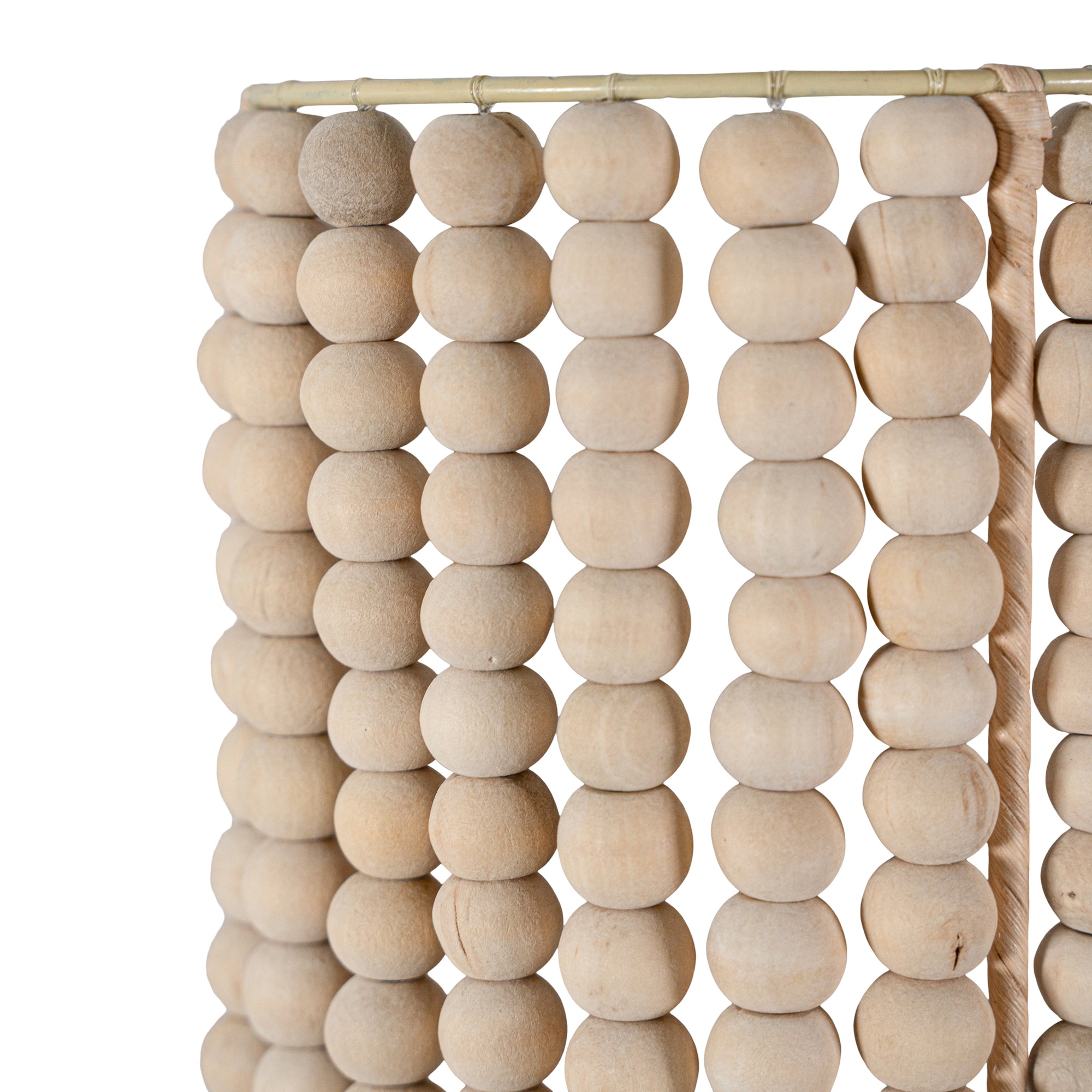 Kwetu sconce featuring hand-strung natural wooden beads in a cylindrical design, perfect for adding soft, textural lighting to relaxed interiors