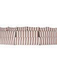 Laguna modular sofa in cinnabar stripe fabric with curved form and soft cushions on a clean background.