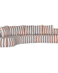 Laguna modular sofa in cinnabar stripe fabric with curved form and soft cushions on a clean background.