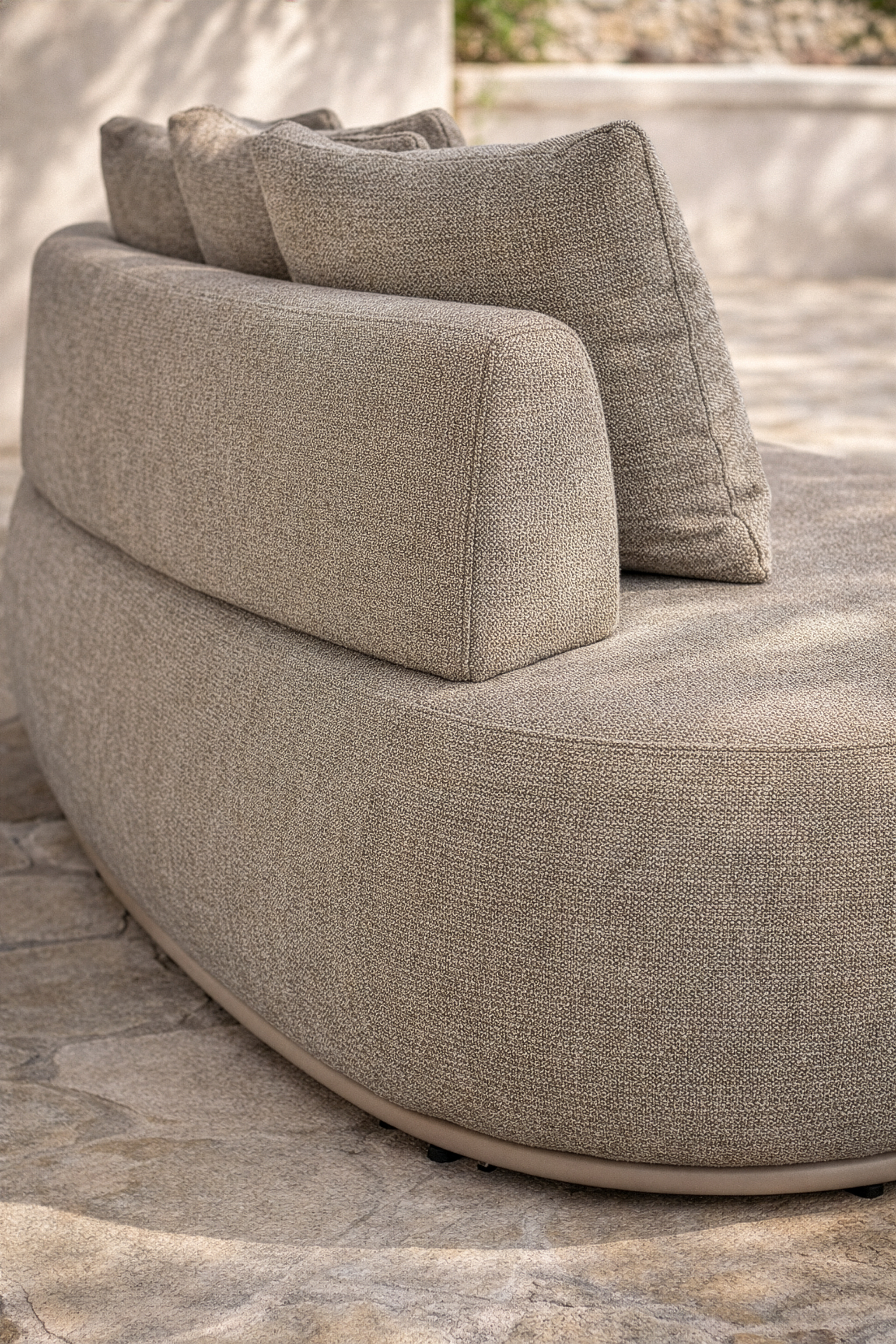 Close up of Laguna sofa in oat drift fabric showing soft texture, curved form and plush cushions.
