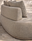 Close up of Laguna sofa in oat drift fabric showing soft texture, curved form and plush cushions.