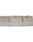 Laguna modular sofa in oat drift fabric with curved form and soft cushions on a clean background.
