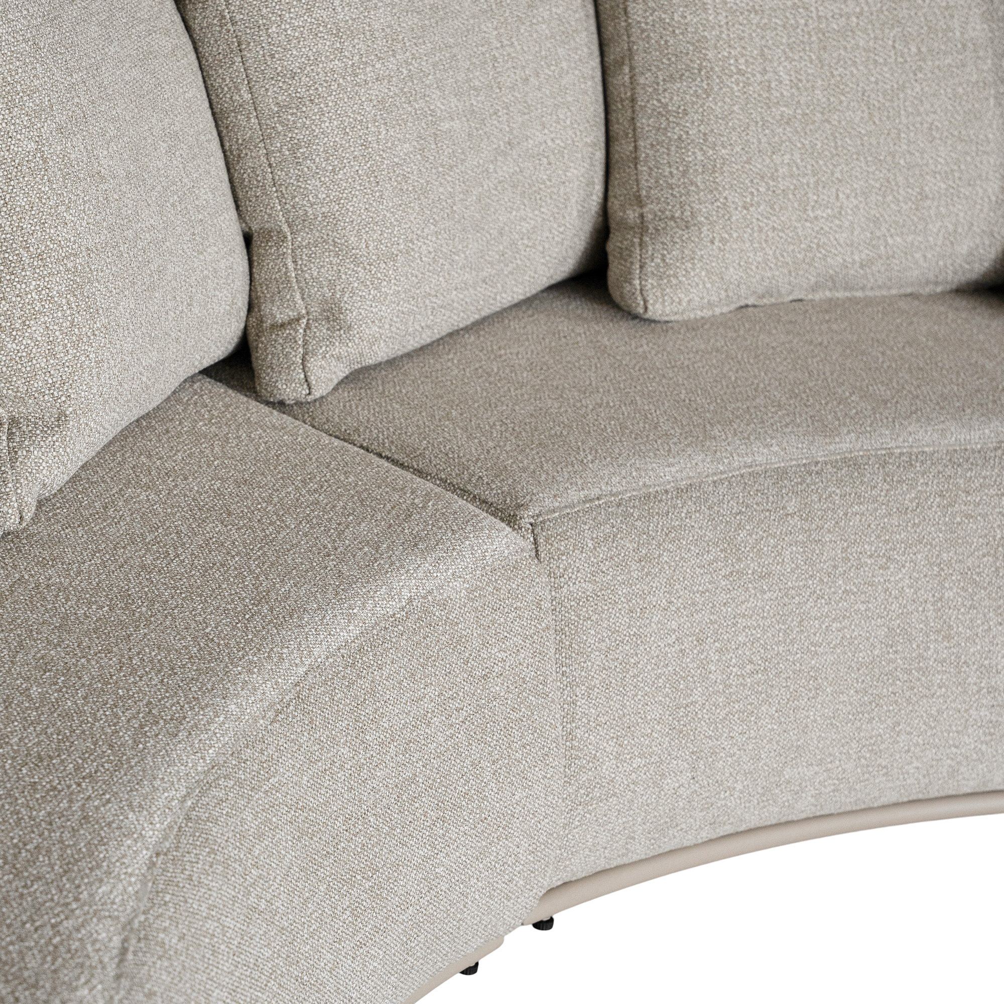 Laguna modular sofa in oat drift fabric with curved form and soft cushions on a clean background.