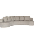 Laguna modular sofa in oat drift fabric with curved form and soft cushions on a clean background.