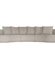 Laguna modular sofa in oat drift fabric with curved form and soft cushions on a clean background.