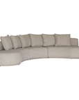 Laguna modular sofa in oat drift fabric with curved form and soft cushions on a clean background.