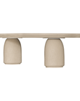 Lantara coffee table in driftstone finish with sculptural pedestal base and soft rounded top.