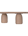 Lantara coffee table large in nomad dune finish with elongated oval top and three rounded sculptural legs.