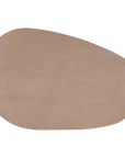 Lantara coffee table large in nomad dune finish with elongated oval top and three rounded sculptural legs.