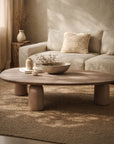 Lantara large coffee table in nomad dune styled in a warm neutral living room with textured rug and soft sofa backdrop.