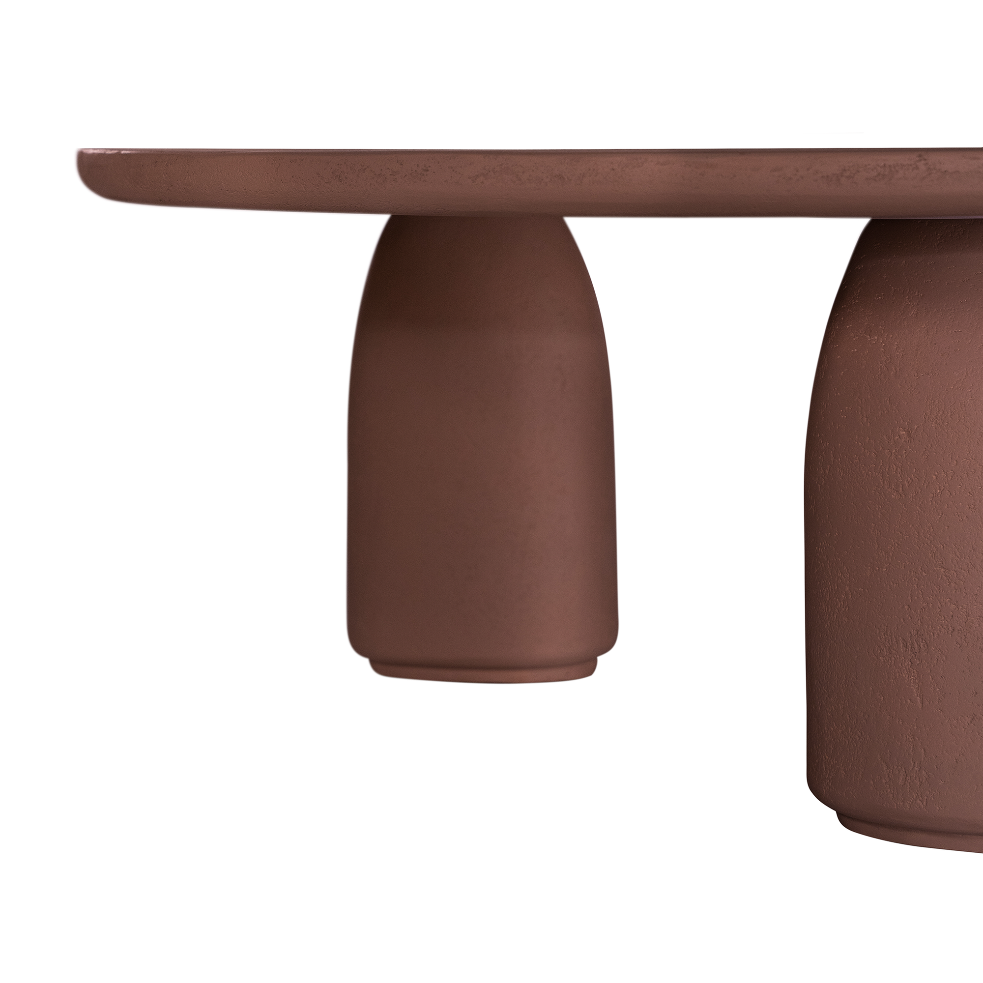 Lantara coffee table in cinnabar clay finish with rounded top and three rounded sculptural legs.