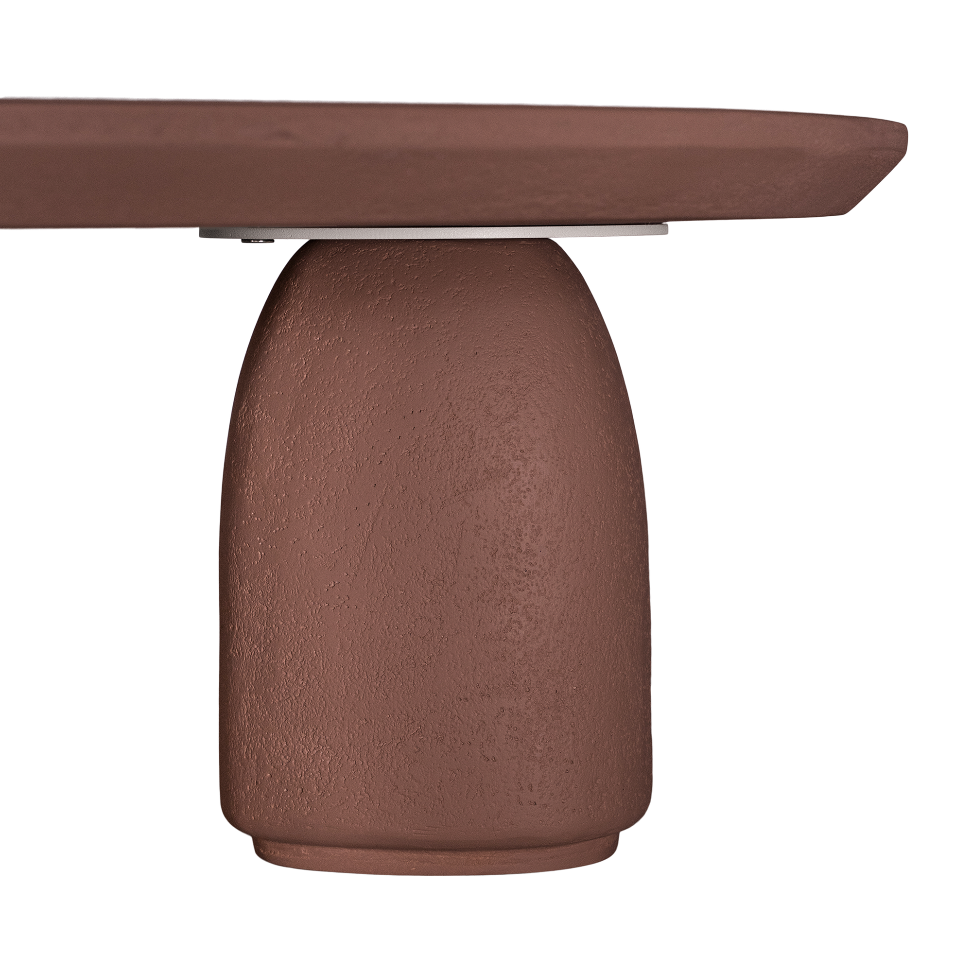 Lantara coffee table in cinnabar clay finish with rounded top and three rounded sculptural legs.