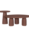 Lantara coffee table in cinnabar clay finish with rounded top and three rounded sculptural legs.