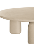 Lantara coffee table in driftstone finish with sculptural pedestal base and soft rounded top.