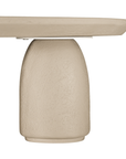 Lantara coffee table in driftstone finish with sculptural pedestal base and soft rounded top.