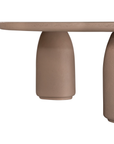 Lantara coffee table small in nomad dune finish with rounded top and three sculptural cylindrical legs.