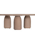 Lantara coffee table small in nomad dune finish with rounded top and three sculptural cylindrical legs.