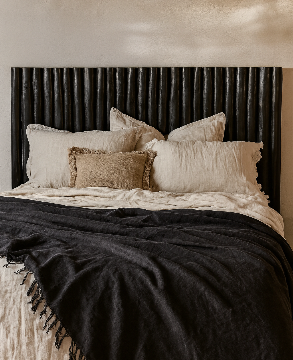 Latte bedhead black styled with layered linen bedding in a modern organic mediterranean inspired australian bedroom
