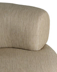 A contemporary latte upholstered lounge chair with a low-profile design and curved backrest. This modern, armless seating piece features a smooth, rounded silhouette, making it a stylish and comfortable addition to any living space