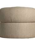 A contemporary latte upholstered lounge chair with a low-profile design and curved backrest. This modern, armless seating piece features a smooth, rounded silhouette, making it a stylish and comfortable addition to any living space
