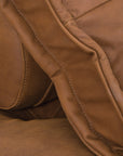 A stylish leather modular sofa with a low-profile design and plush cushioning, offering a relaxed and contemporary seating option for modern interiors