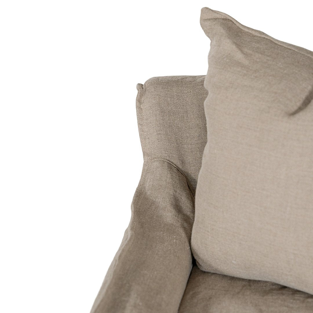 Natural linen three seater sofa with plush cushions, featuring a relaxed and stylish design for effortless comfort