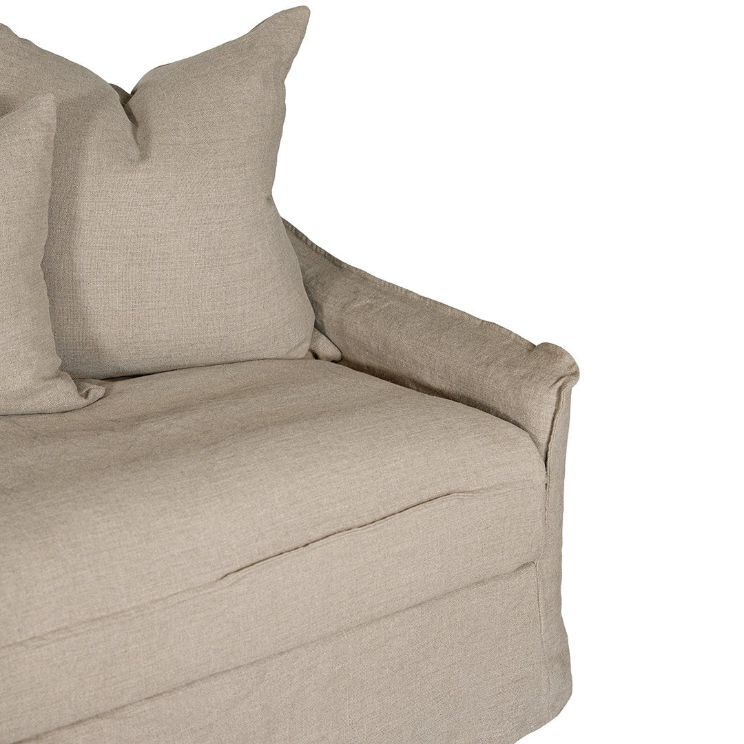 Natural linen three seater sofa with plush cushions, featuring a relaxed and stylish design for effortless comfort