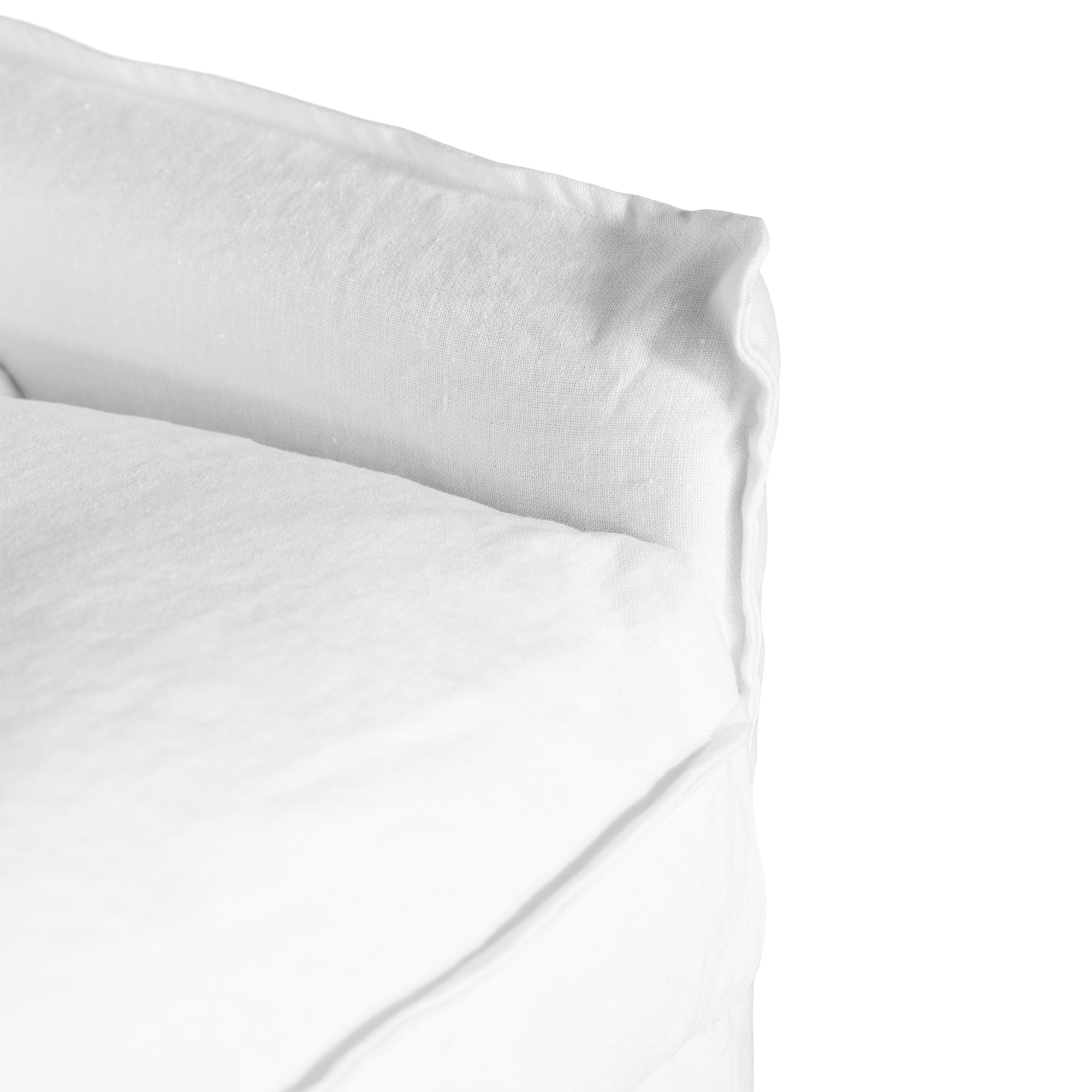 White linen three seater sofa with plush cushions, featuring a relaxed and stylish design for effortless comfort