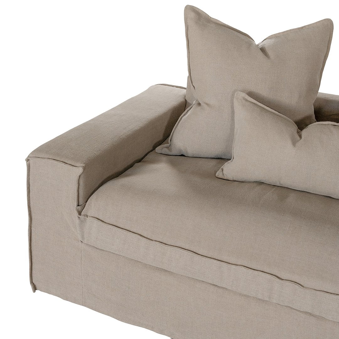 Linen slipcover sectional sofa, designed for effortless comfort and relaxed elegance. Features a modular design with plush cushions and a timeless neutral hue