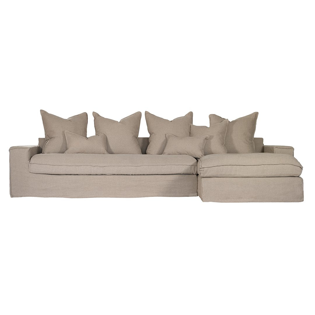 Linen slipcover sectional sofa, designed for effortless comfort and relaxed elegance. Features a modular design with plush cushions and a timeless neutral hue