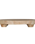 Lumara cheese plate in solid natural wood with round profile, visible timber grain and low pedestal feet.