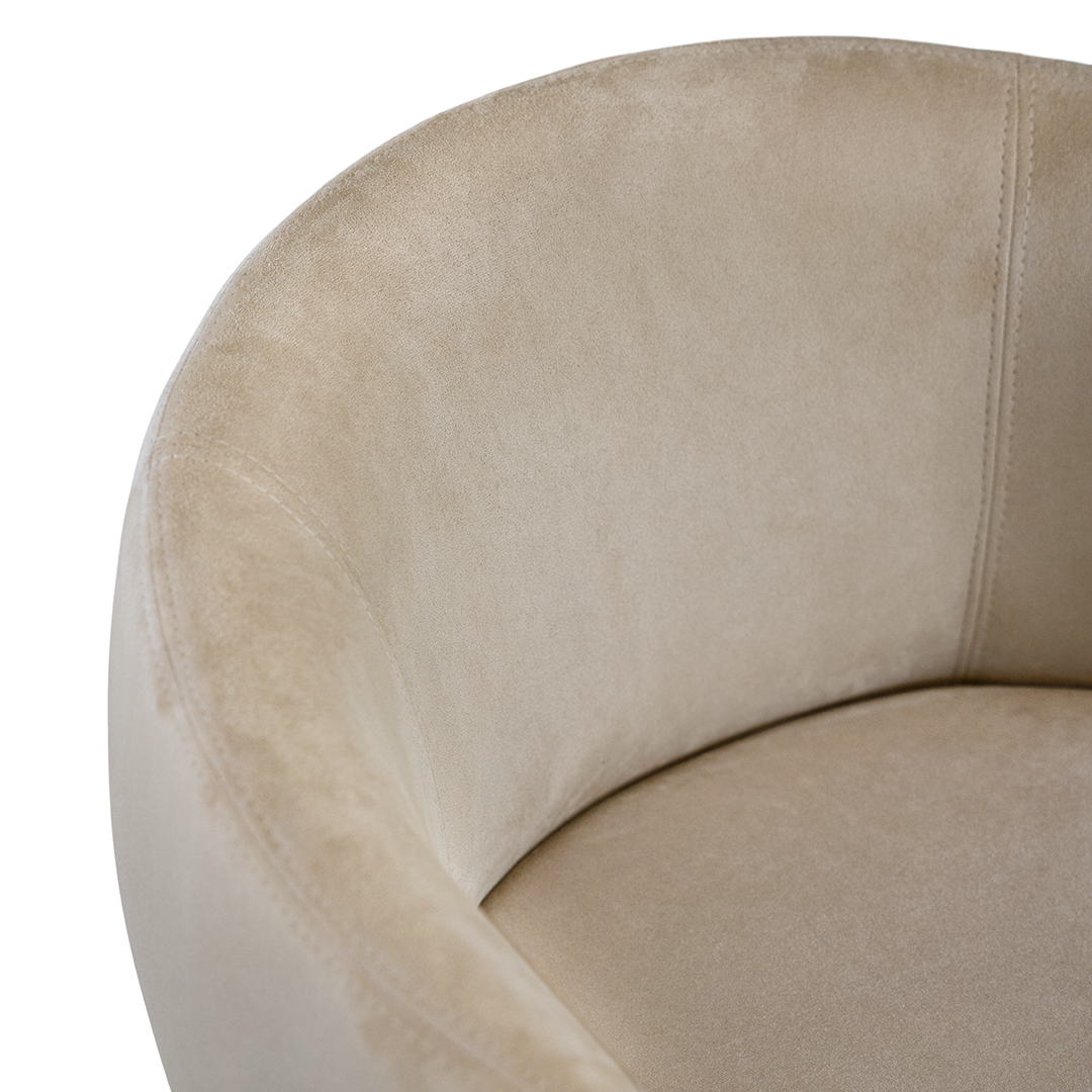 Lumo dining chair in bone with soft upholstered seat and curved backrest on slim black legs shown in a clean minimal setting.