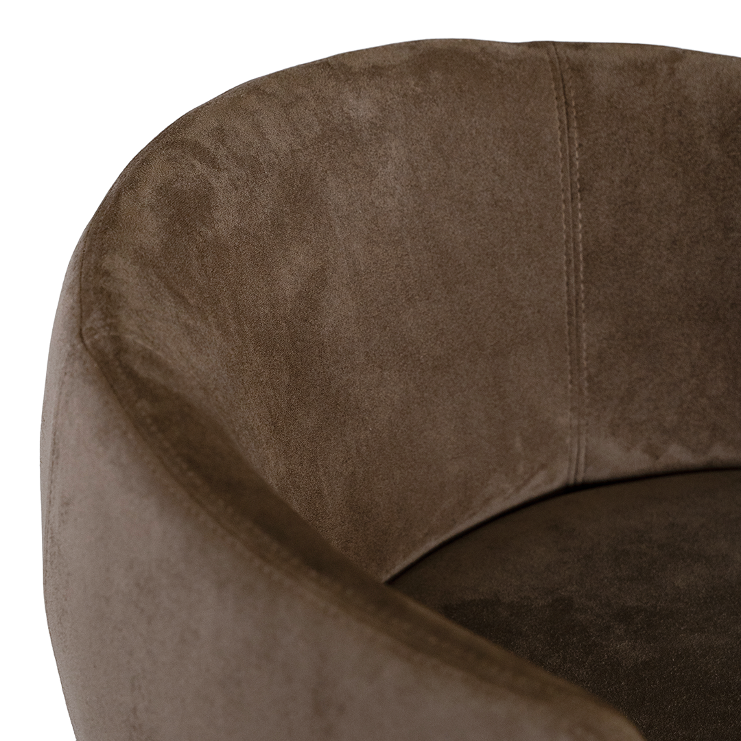 Lumo dining chair in cocoa with soft upholstered seat and curved backrest on slim black legs shown in a clean minimal setting.