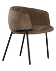 Lumo dining chair in cocoa with soft upholstered seat and curved backrest on slim black legs shown in a clean minimal setting.
