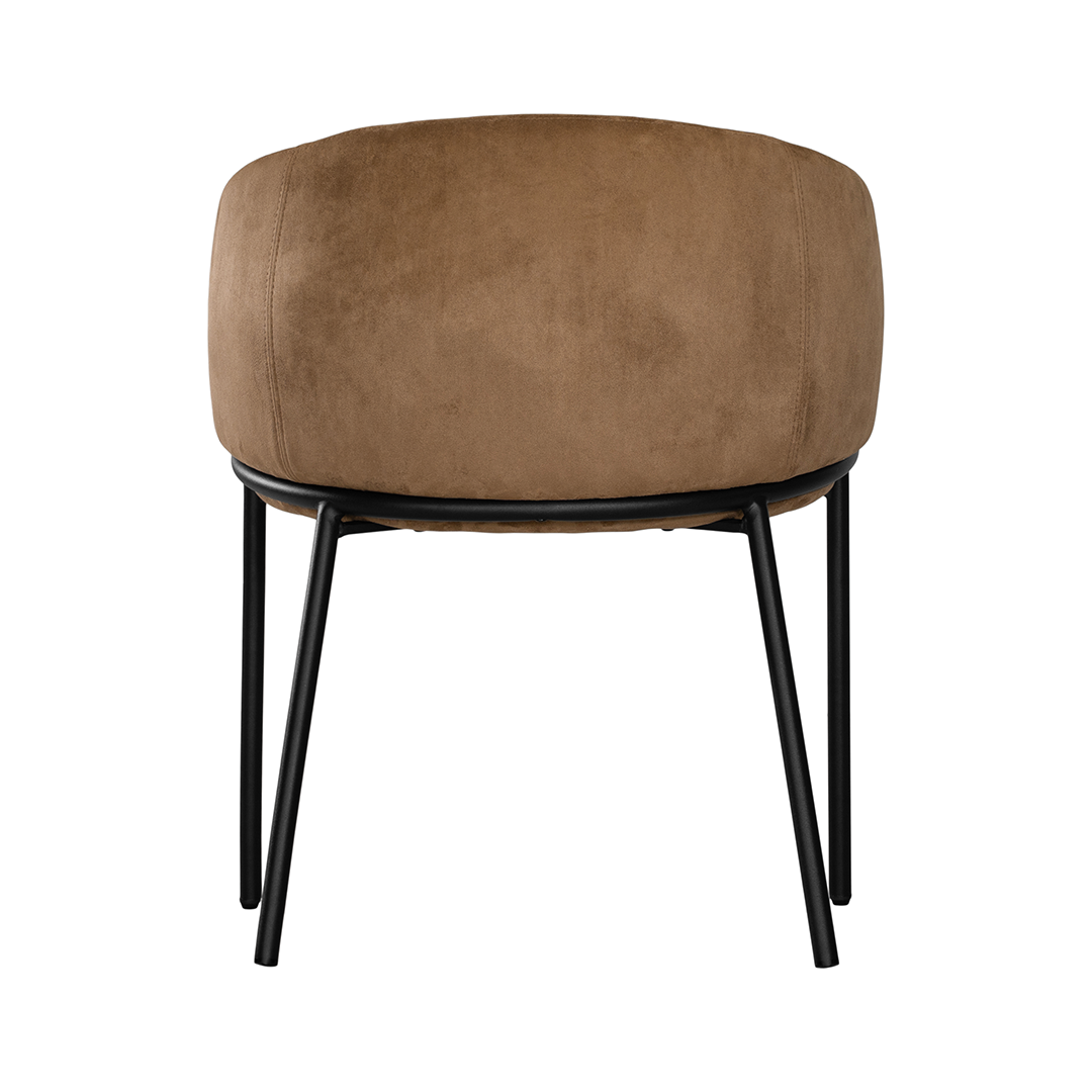 Lumo dining chair in hazelnut with soft upholstered seat and curved backrest on slim black legs shown in a clean minimal setting.