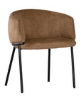 Lumo dining chair in hazelnut with soft upholstered seat and curved backrest on slim black legs shown in a clean minimal setting.
