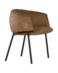 Lumo dining chair in hazelnut with soft upholstered seat and curved backrest on slim black legs shown in a clean minimal setting.