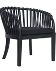 Makena chair in black rattan with a linen seat cushion, featuring a curved backrest and sturdy timber frame, perfect for a relaxed dining setting