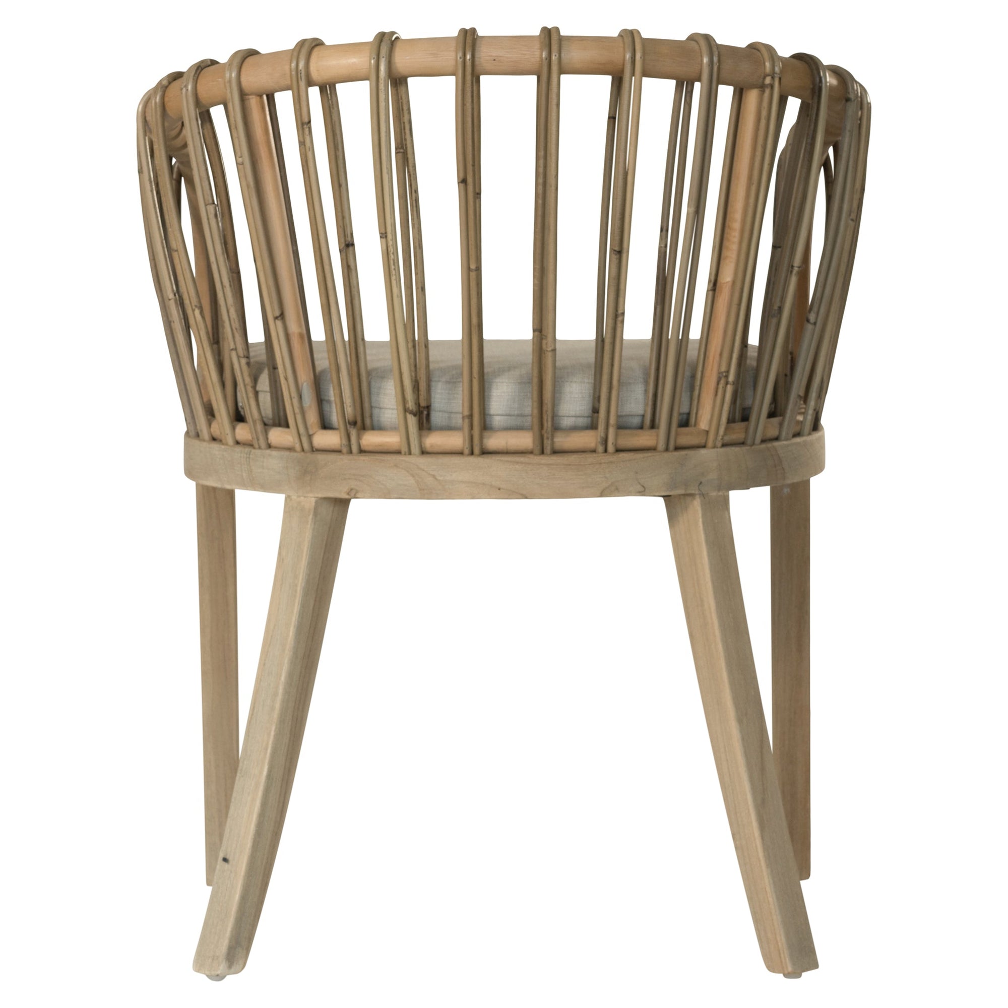 Makena chair in natural rattan with a linen seat cushion, featuring a curved backrest and sturdy timber frame, perfect for a relaxed dining setting