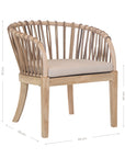 Makena chair in natural rattan with a linen seat cushion, featuring a curved backrest and sturdy timber frame, perfect for a relaxed dining setting