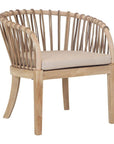 Makena chair in natural rattan with a linen seat cushion, featuring a curved backrest and sturdy timber frame, perfect for a relaxed dining setting