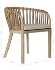 Makena chair in natural rattan with a linen seat cushion, featuring a curved backrest and sturdy timber frame, perfect for a relaxed dining setting